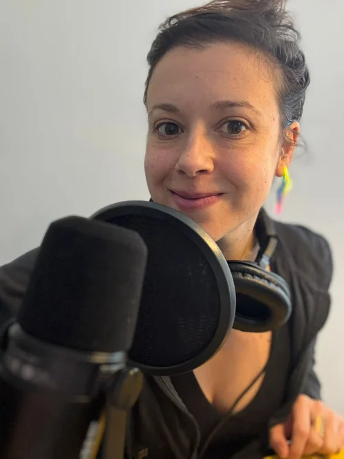 Dana recording a podcast